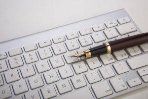 63041850 - fountain pen and computer keyboard